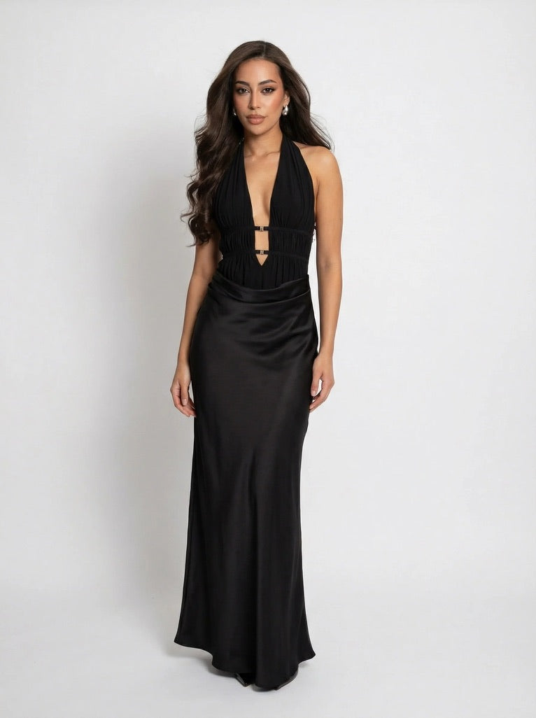 Woman wearing a black evening gown on a white background