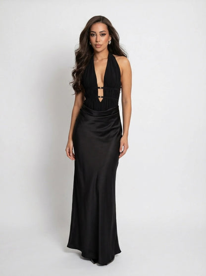 Woman wearing a black evening gown on a white background