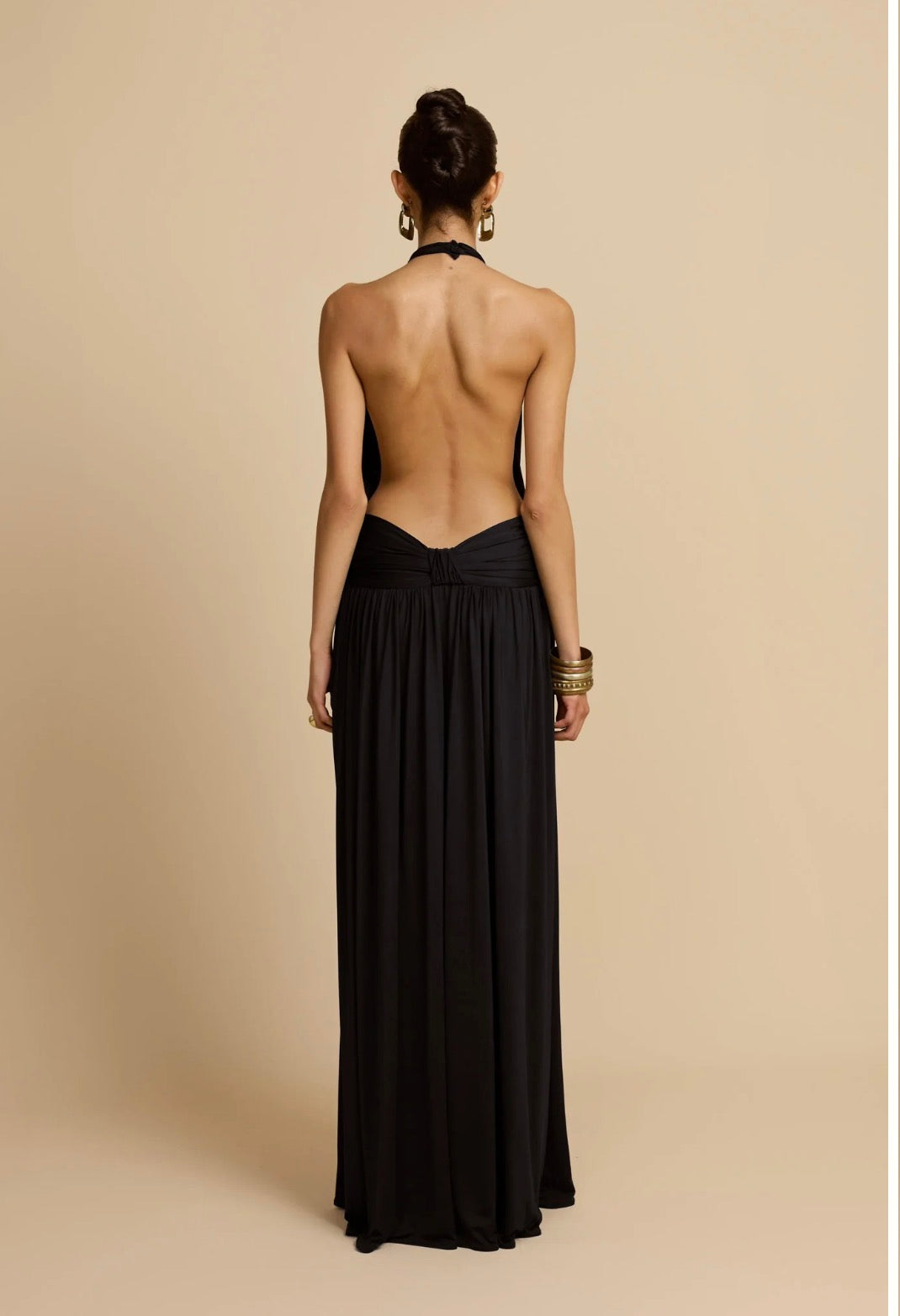 Black halter gown, open back, studio shot