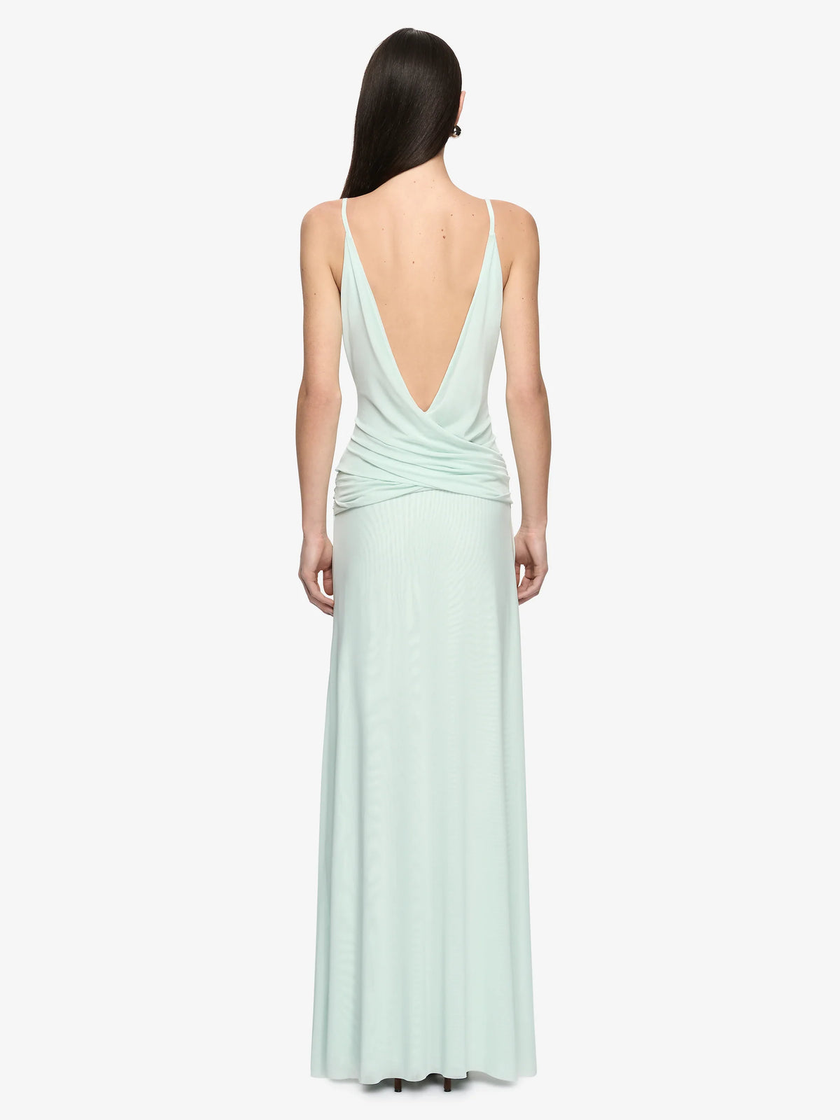 Mint green evening gown with a deep neckline on a white background